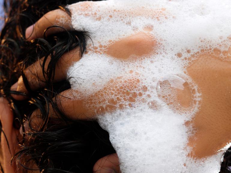 The ideal hair-washing schedule varies from person to person, experts say. 
