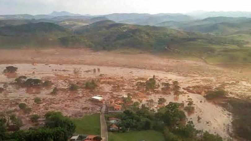 Flooding after a mine dam burst near Mariana, Brazil, in 2015