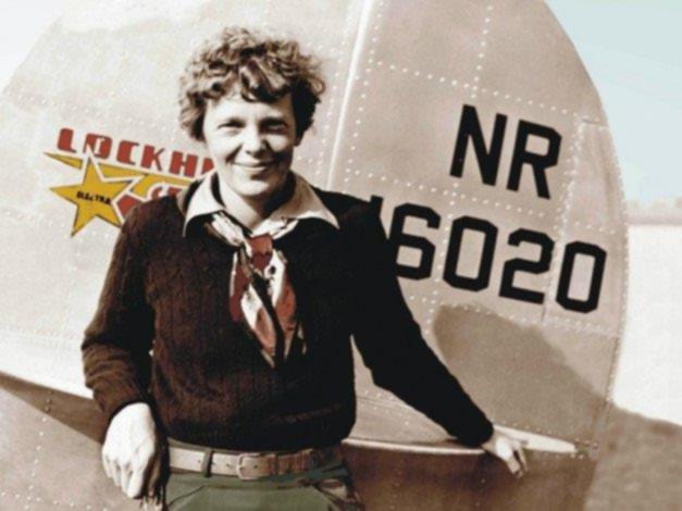 Amelia Earhart stands with her Lockheed Electra in 1937 before she and her aircraft went missing.