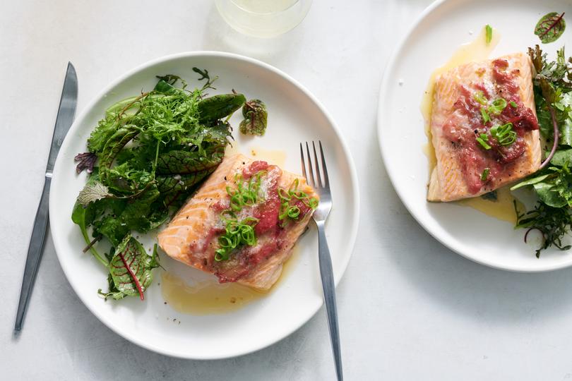 Rhubarb roasted salmon in New York, May 23, 2023. Paired with red rhubarb, these brilliantly pink fillets from Melissa Clark are on the table in 25 minutes. Food styled by Simon Andrews. (David Malosh/The New York Times)