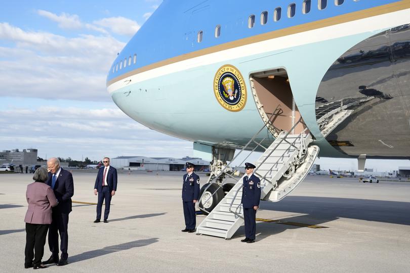 President Joe Biden greets Mayor Daniella Levine Cava of Miami-Dade County as he arrives at Miami International Airport Tuesday, Jan. 30, 2024, in Miami. Biden will attend a fundraiser while in Miami. (AP Photo/Evan Vucci)