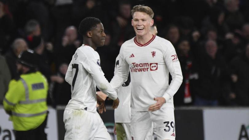 Goalscorers Kobbie Mainoo (l) and Scott McTominay celebrate Manchester United's win over Wolves. (AP PHOTO)