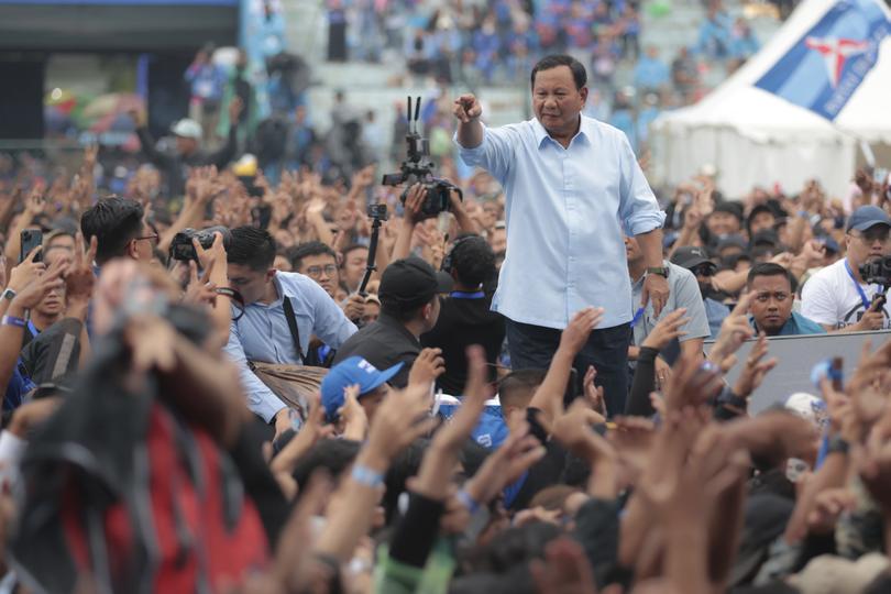 Indonesian presidential candidate Prabowo Subianto greets supporters during his campaign rally in Malang, East Java, Indonesia Thursday, Feb. 1, 2024. The world's third-largest democracy is scheduled to hold its legislative and presidential elections on Feb. 14, 2024. The election will determine who will succeed the incumbent President Joko Widodo, who is serving his second and final term. (AP Photo/Trisnadi)