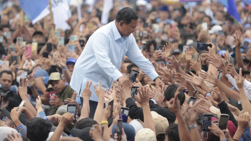 Indonesian presidential candidate Prabowo Subianto greets supporters during his campaign rally in East Java.