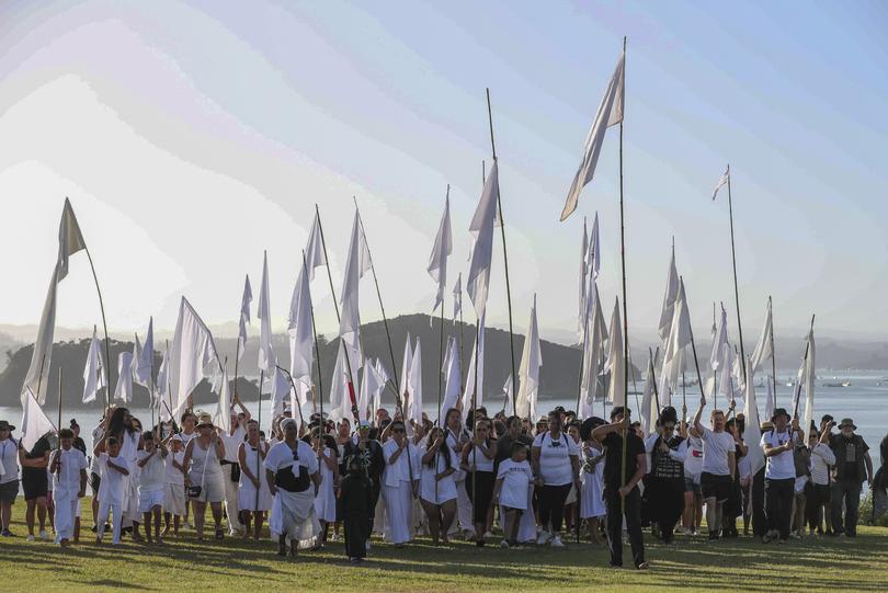 New Zealand Maori activists march into the Waitangi Treaty House grounds ahead of Waitangi Day celebrations in Waitangi, northern New Zealand, Monday, Feb. 5, 2024. In a fiery exchange at the birthplace of modern New Zealand, Indigenous leaders strongly criticized the current government's approach to Maori, ahead of the country’s national day.(Michael Cunningham/NZ Herald via AP)