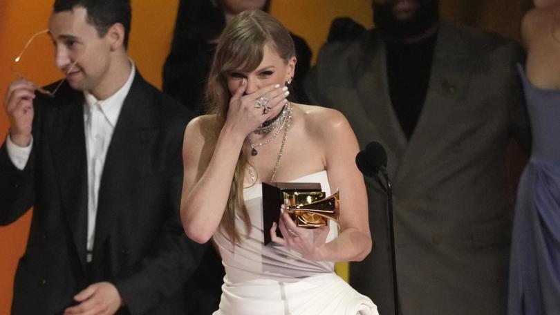 Taylor Swift accepts the award for album of the year for "MIdnights" during the 66th annual Grammy Awards on Sunday, Feb. 4, 2024, in Los Angeles. (AP Photo/Chris Pizzello)