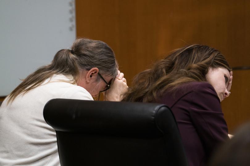Jennifer Crumbley, left, weeps as her attorney Shannon Smith holds her head in her hands as surveillance video was displayed for the jury showing the 2021 shooting at Oxford High School in the Oakland County courtroom Thursday, Feb. 1, 2024 in Pontiac, Mich. Crumbley is being tried on four counts of involuntary manslaughter for the four students killed by her son, Ethan Crumbley in 2021.    (Mandi Wright/Detroit Free Press via AP, Pool)