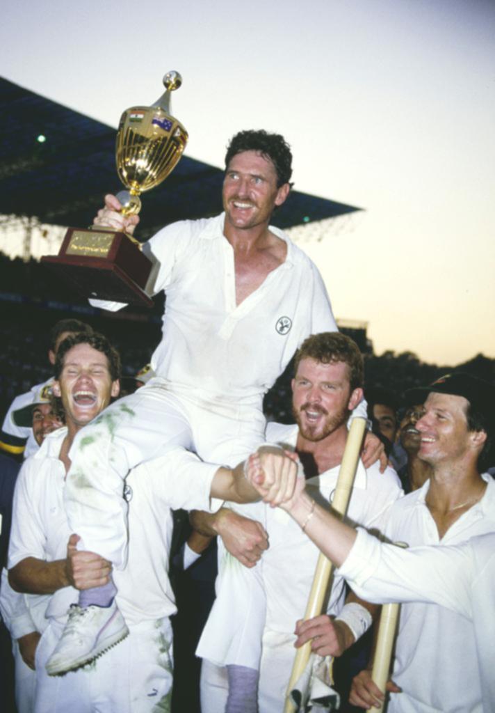 CALCUTTA, INDIA - NOVEMBER 08: Australia Captain Allan Border holds the trophy with support from Dean Jones (l) Craig McDermott (c) and Steve Waugh (r) as Australia celebrate winning the 1987 ICC Cricket World Cup final against England on November 8th, 1987 in Calcutta, India. (Photo by Chris Cole/Allsport/Getty Images/Hulton Archive)