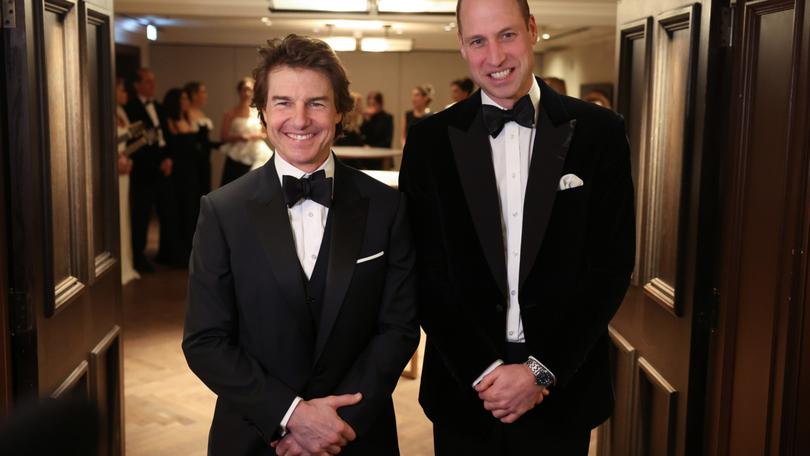 Britain's Prince William, Prince of Wales poses for a photo with US actor Tom Cruise at the London Air Ambulance Charity Gala Dinner.