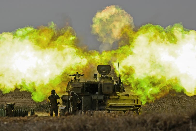 *2023 Getty Images Global Year In Review - News* - NETIVOT, ISRAEL - OCTOBER 11: (EDITOR'S NOTE: Alternate crop) An IDF artillery unit fires towards Gaza on October 11, 2023 near Netivot, Israel. Israel has sealed off Gaza and conducted airstrikes on Palestinian territory after an attack by Hamas killed hundreds with more than 100 hostages taken. On October 7, the Palestinian militant group Hamas launched a surprise attack on Israel from Gaza by land, sea, and air, killing over 1200 people and wounding more than 2000. Israeli soldiers and civilians have also been taken hostage by Hamas and moved into Gaza. The attack prompted a declaration of war by Israeli Prime Minister Benjamin Netanyahu. (Photo by Alexi J. Rosenfeld/Getty Images)