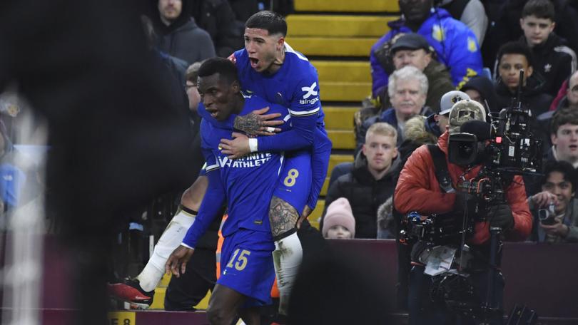 Chelsea's Nicolas Jackson, left, celebrates with his teammate Enzo Fernandez after scoring his side's second goal during the English FA Cup fourth round soccer match between Aston Villa and Chelsea at the Villa Park Stadium in Birmingham, England, Wednesday, Feb. 7, 2024. (AP Photo/Rui Vieira)