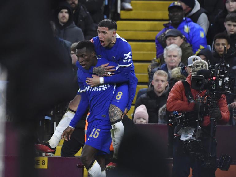 Chelsea's Nicolas Jackson, left, celebrates with his teammate Enzo Fernandez after scoring his side's second goal during the English FA Cup fourth round soccer match between Aston Villa and Chelsea at the Villa Park Stadium in Birmingham, England, Wednesday, Feb. 7, 2024. (AP Photo/Rui Vieira)