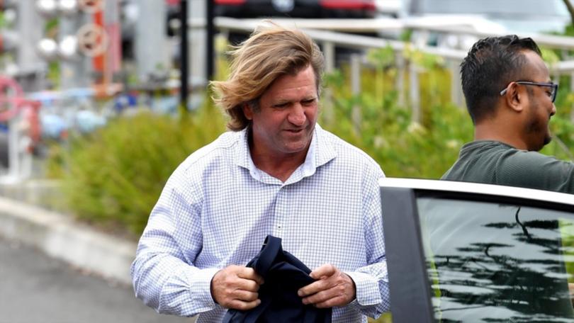 Des Hasler (centre) told Keith Titmuss's family he was heartbroken at the player's death. (Bianca De Marchi/AAP PHOTOS)