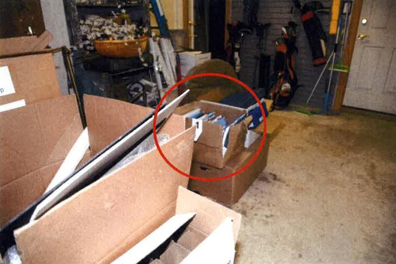 This image, contained in the report from special counsel Robert Hur, and annotated by source, shows a damaged box where classified documents were found in the garage of President Joe Biden in Wilmington, Del., during a search by the FBI on Dec. 21, 2022. (Justice Department via AP)