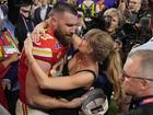 Kansas City Chiefs tight end Travis Kelce (87) embraces Taylor Swift after the NFL Super Bowl 58 football game.