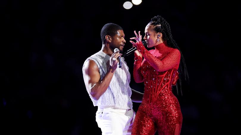 Usher and Alicia Keys perform onstage during the Apple Music Super Bowl.