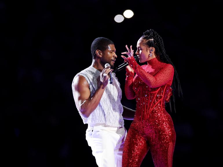 Usher and Alicia Keys perform onstage during the Apple Music Super Bowl.