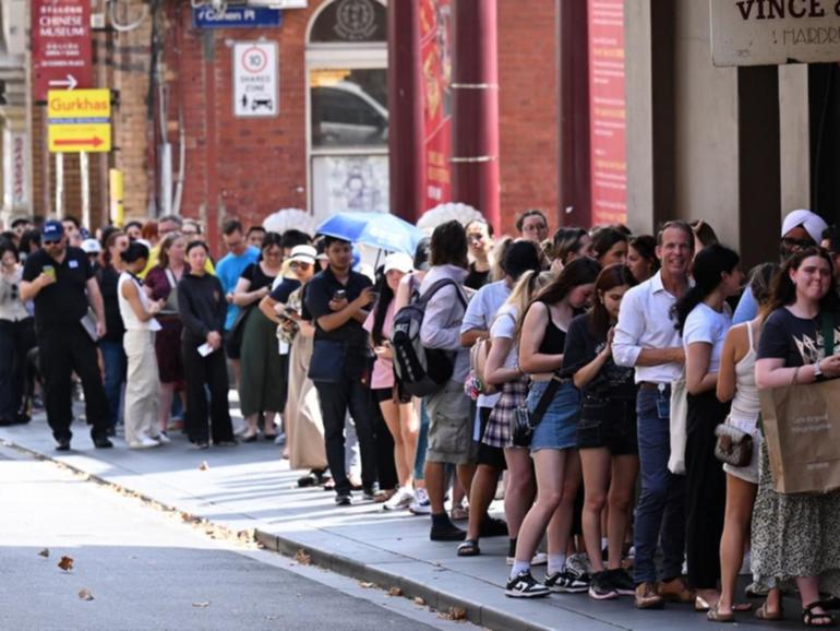 People line up to purchase Taylor Swift The Eras Tour tickets at Ticketek's office in Melbourne. (James Ross/AAP PHOTOS)