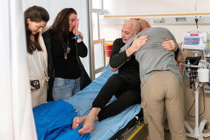 Hostage Luis Har, center, is hugged by relatives after being rescued from captivity in the Gaza Strip, at the Sheba Medical Center in Ramat Gan, Israel, Monday, Feb. 12, 2024.