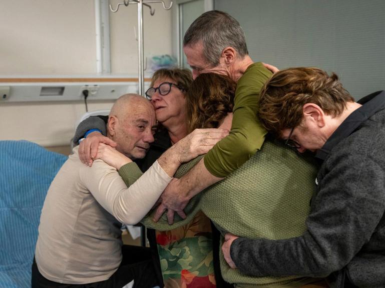 Hostage Luis Har, left, is hugged by relatives after being rescued from captivity in the Gaza Strip, at the Sheba Medical Center in Ramat Gan, Israel, Monday, Feb. 12, 2024. 