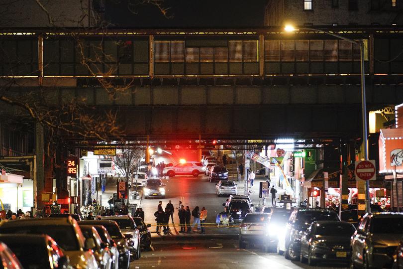 Police officers gather following a shooting at the Mount Eden Avenue subway station, Monday, Feb. 12, 2024, in the Bronx borough of New York.  (AP Photo/Eduardo Munoz Alvarez)