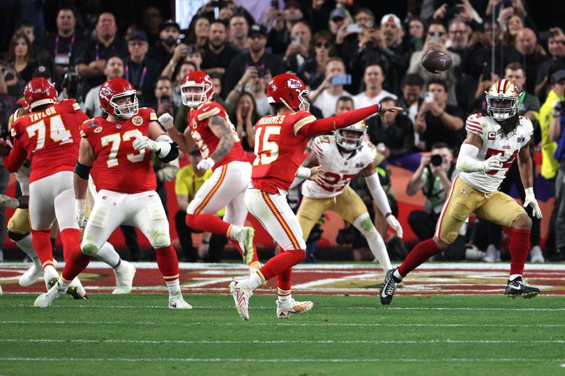 LAS VEGAS, NEVADA - FEBRUARY 11: Patrick Mahomes #15 of the Kansas City Chiefs throws the game-winning pass for a touchdown to defeat the San Francisco 49ers 25-22 in overtime during Super Bowl LVIII at Allegiant Stadium on February 11, 2024 in Las Vegas, Nevada. (Photo by Harry How/Getty Images)