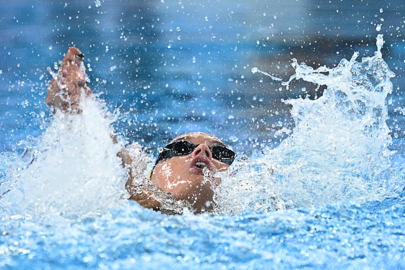 Australia's Iona Anderson competes in a semi-final of the women's 100m backstroke swimming event during the 2024 World Aquatics Championships at Aspire Dome in Doha on February 12, 2024. (Photo by SEBASTIEN BOZON / AFP)