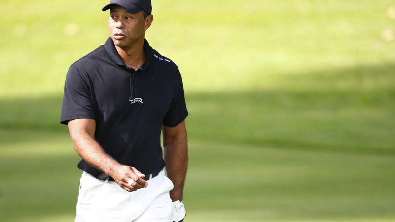 PACIFIC PALISADES, CALIFORNIA - FEBRUARY 13: Tiger Woods of the United States looks on as he practices prior to The Genesis Invitational at Riviera Country Club on February 13, 2024 in Pacific Palisades, California. (Photo by Ronald Martinez/Getty Images)