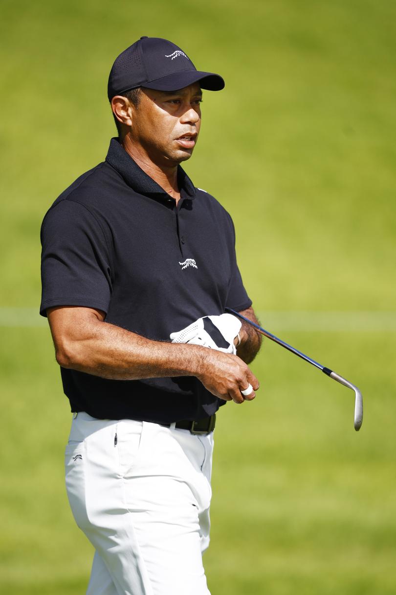 PACIFIC PALISADES, CALIFORNIA - FEBRUARY 13: Tiger Woods of the United States looks on as he practices prior to The Genesis Invitational at Riviera Country Club on February 13, 2024 in Pacific Palisades, California. (Photo by Ronald Martinez/Getty Images)