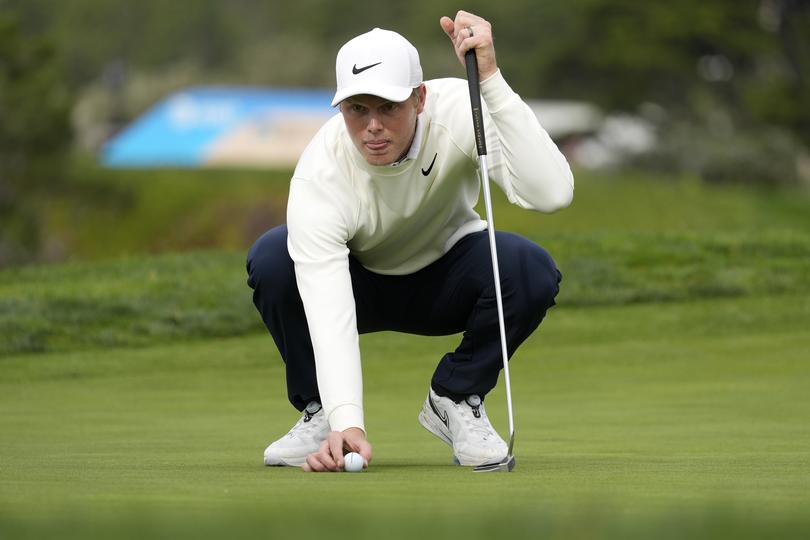 Cam Davis prepares to putt on the fifth green at Pebble Beach Golf Links during the third round of the AT&T Pebble Beach National Pro-Am golf tournament in Pebble Beach, Calif., Saturday, Feb. 3, 2024. (AP Photo/Ryan Sun)