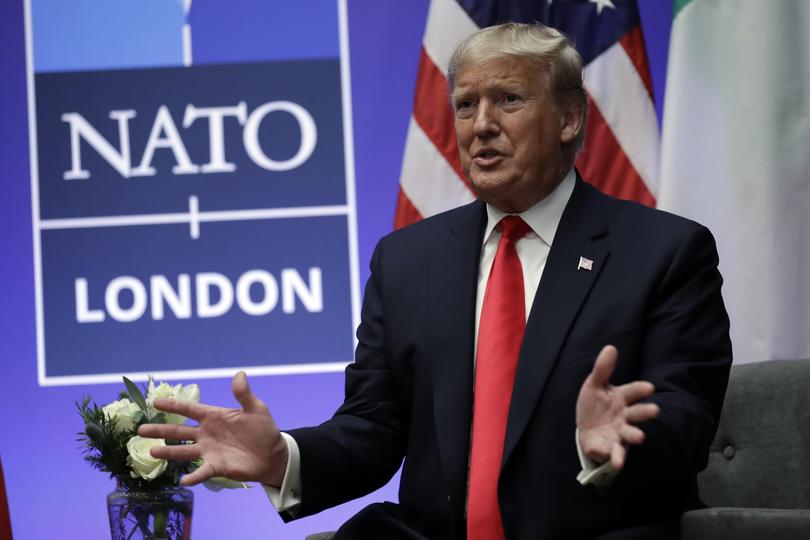 FILE - President Donald Trump meets with Italian Prime Minister Giuseppe Conte during the NATO summit at The Grove, Wednesday, Dec. 4, 2019, in Watford, England.  Former US president Donald Trump says he once warned that he would allow Russia to do whatever it wants to NATO member nations that are “delinquent” in devoting 2% of their gross domestic product to defense. Trump’s comment on Saturday represented the latest instance in which the former president and Republican front-runner seemed to side with an authoritarian state over America’s democratic allies. (AP Photo/ Evan Vucci, File)