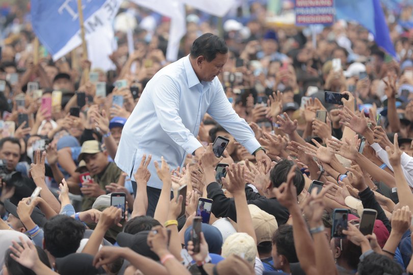 Indonesian presidential candidate Prabowo Subianto greets supporters during his campaign rally in Malang, East Java, Indonesia Thursday, Feb. 1, 2024. The world's third-largest democracy is scheduled to hold its legislative and presidential elections on Feb. 14, 2024. The election will determine who will succeed the incumbent President Joko Widodo, who is serving his second and final term. (AP Photo/Trisnadi)