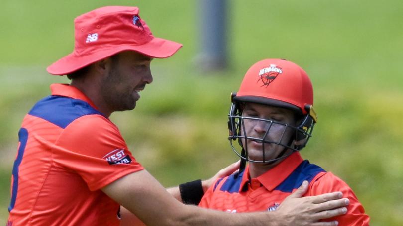 ADELAIDE, AUSTRALIA - FEBRUARY 14:  Alex Carey of the Redbacks celebrates after catching the wicket of   Dylan McLachlan of the Queensland Bulls with  Harry Conway of the Redbacks during the Marsh One Day Cup match between South Australia and Queensland at Karen Rolton Oval, on February 14, 2024, in Adelaide, Australia. (Photo by Mark Brake/Getty Images)