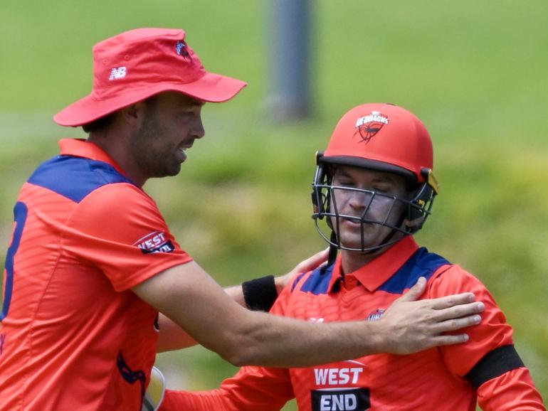 ADELAIDE, AUSTRALIA - FEBRUARY 14:  Alex Carey of the Redbacks celebrates after catching the wicket of   Dylan McLachlan of the Queensland Bulls with  Harry Conway of the Redbacks during the Marsh One Day Cup match between South Australia and Queensland at Karen Rolton Oval, on February 14, 2024, in Adelaide, Australia. (Photo by Mark Brake/Getty Images)