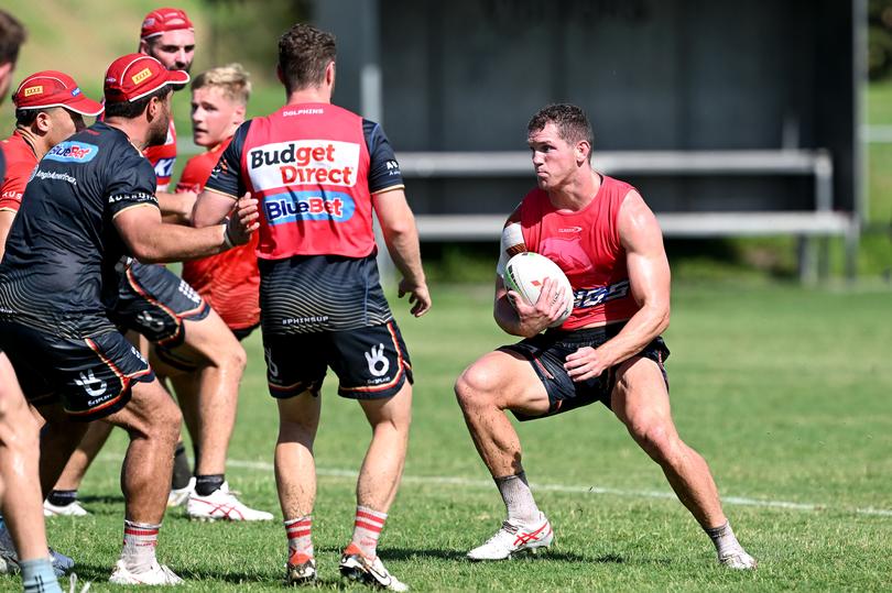 BRISBANE, AUSTRALIA - JANUARY 16: Tom Gilbert looks to take on the defence during a Dolphins NRL training session at Kayo Stadium on January 16, 2024 in Brisbane, Australia. (Photo by Bradley Kanaris/Getty Images)