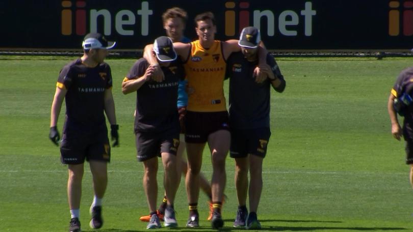 James Blanck goes down in a tackle at Hawthorn training.
