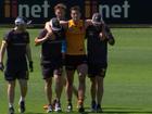 James Blanck goes down in a tackle at Hawthorn training.