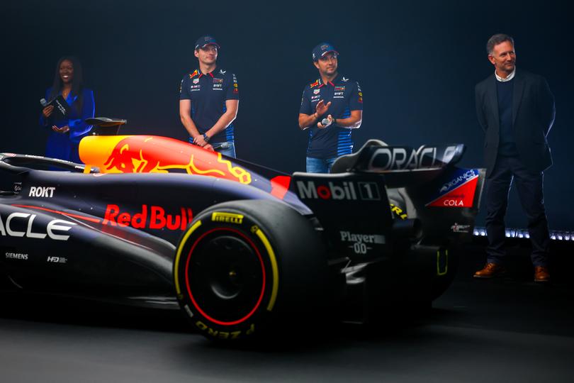 MILTON KEYNES, ENGLAND - FEBRUARY 15: Max Verstappen of the Netherlands and Oracle Red Bull Racing, Sergio Perez of Mexico and Oracle Red Bull Racing and Red Bull Racing Team Principal Christian Horner stand with the RB20 during the Oracle Red Bull Racing RB20 car launch at Red Bull Racing Factory on February 15, 2024 in Milton Keynes, England. (Photo by Mark Thompson/Getty Images for Red Bull Racing)