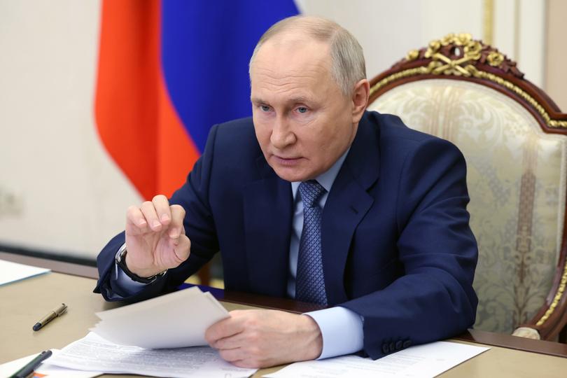 Russian President Vladimir Putin attends a meeting with members of the Russian cabinet of ministers via videoconference in Moscow, Russia, Wednesday, Feb. 7, 2024. (Alexander Kazakov, Sputnik, Kremlin Pool Photo via AP)