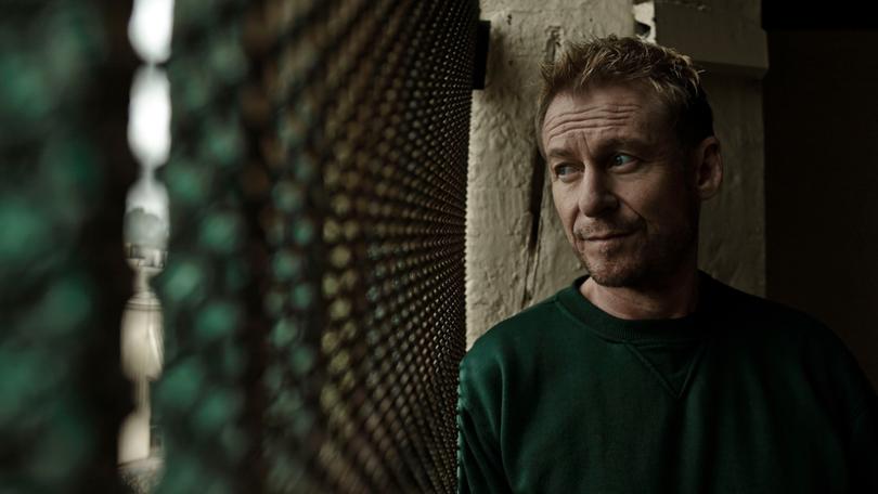 Cleaver Greene (Richard Roxburgh) is on the wrong side of the prison fences in the season three premiere of Rake