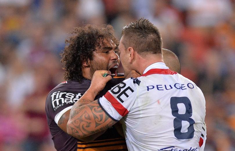 BRISBANE, AUSTRALIA - APRIL 10:  Sam Thaiday of the Broncos and Jared Waerea-Hargreaves of the Roosters face off during the round six NRL match between the Brisbane Broncos and the Sydney Roosters at Suncorp Stadium on April 10, 2015 in Brisbane, Australia.  (Photo by Bradley Kanaris/Getty Images)