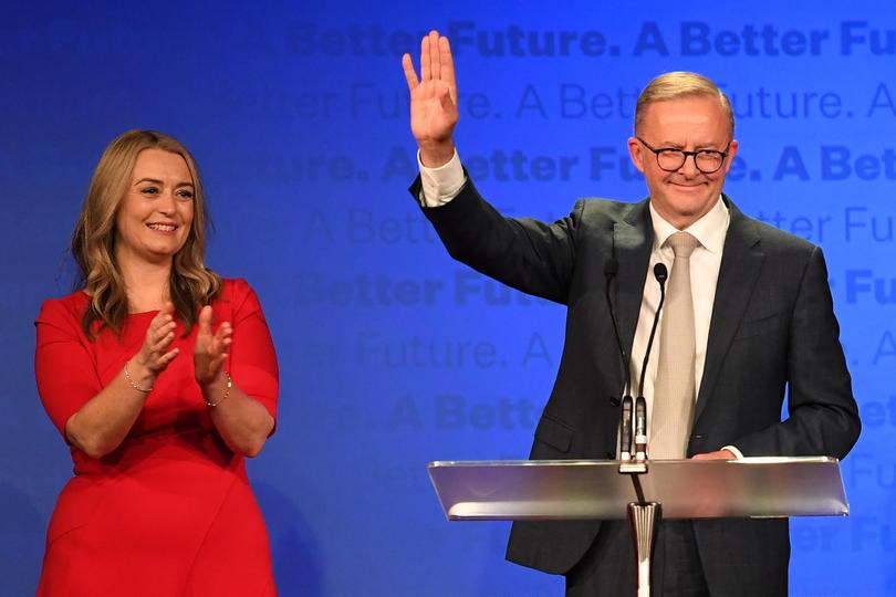 Anthony Albanese delivers his victory speech alongside partner Jodie Haydon on election night.
