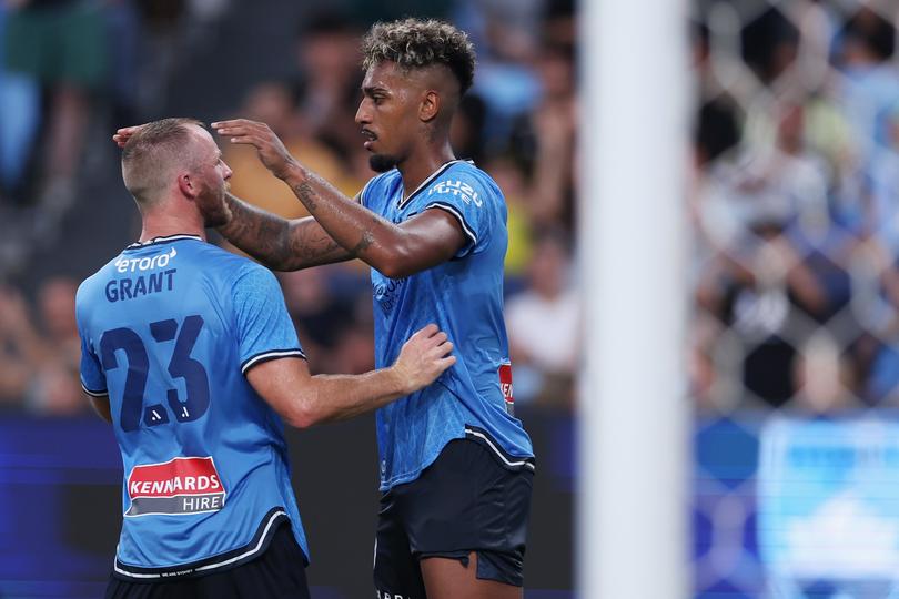 SYDNEY, AUSTRALIA - FEBRUARY 17: Fabio Gomes of Sydney FC is embraced by Ryan Grant of Sydney FC after kicking a penalty goal during the A-League Men round 17 match between Sydney FC and Adelaide United at Allianz Stadium, on February 17, 2024, in Sydney, Australia. (Photo by Cameron Spencer/Getty Images)