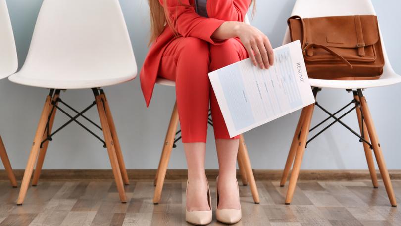 Young woman waiting for interview indoors