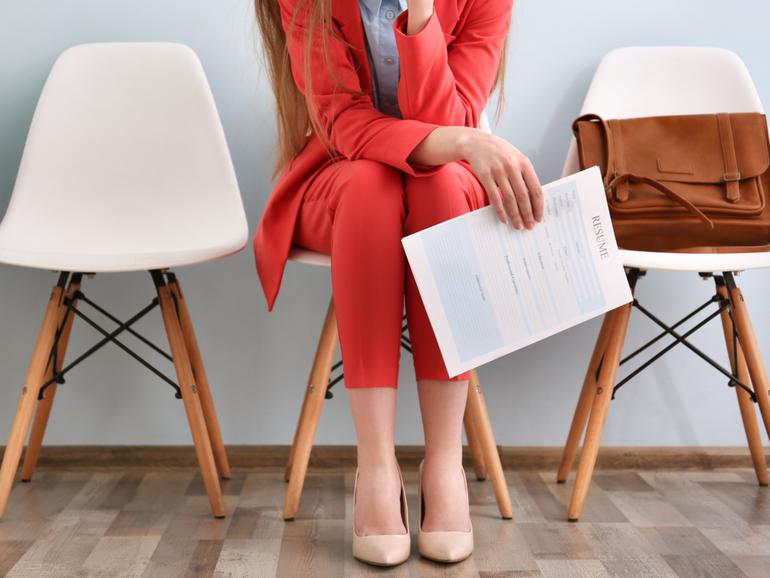 Young woman waiting for interview indoors