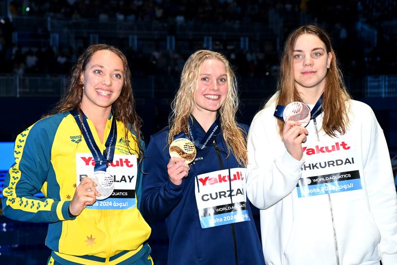 DOHA, QATAR - FEBRUARY 17: (L-R) Silver Medalist, Jaclyn Barclay of Team Australia, Gold Medalist, Claire Curzan of Team United States and Bronze Medalist, Anastasiya Shkurdai of Team Neutral Independent Athletes pose with their medals after the Medal Ceremony for the Women's 200m Backstroke Final on day sixteen of the Doha 2024 World Aquatics Championships at Aspire Dome on February 17, 2024 in Doha, Qatar. (Photo by Adam Nurkiewicz/Getty Images)