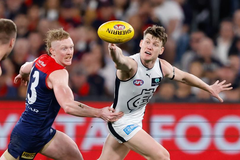 MELBOURNE, AUSTRALIA - SEPTEMBER 15: Sam Walsh of the Blues and Clayton Oliver of the Demons compete for the ball during the 2023 AFL First Semi Final match between the Melbourne Demons and the Carlton Blues at Melbourne Cricket Ground on September 15, 2023 in Melbourne, Australia. (Photo by Dylan Burns/AFL Photos)