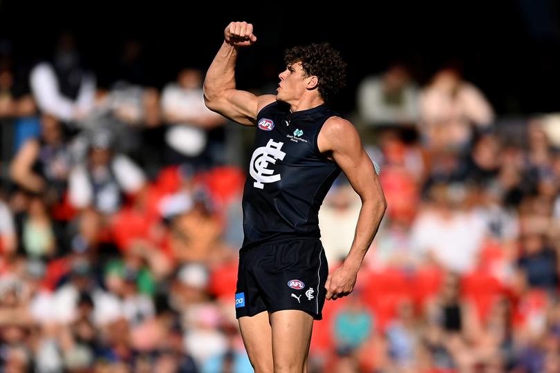 GOLD COAST, AUSTRALIA - AUGUST 19: Charlie Curnow of the Blues celebrates kicking a goal during the round 23 AFL match between Gold Coast Suns and Carlton Blues at Heritage Bank Stadium, on August 19, 2023, in Gold Coast, Australia. (Photo by Albert Perez/AFL Photos via Getty Images)