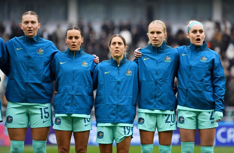 TASHKENT, UZBEKISTAN - FEBRUARY 24: Clare Hunt, Mackenzie Arnold, Katrina Gorry, Kaitlyn Torpey and Jada Mathyssen-Whyman of Australia  line up during the National Anthems prior to the AFC Women's Paris 2024 Olympic Qualifier Round 3 match between Uzbekistan and Australia Matildas at Milliy Stadium on February 24, 2024 in Tashkent, Uzbekistan. (Photo by Tolib Kosimov/Getty Images)