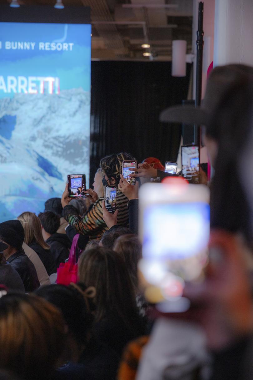 \Audience members record a fashion show for girls in New York on Feb. 10, 2024.